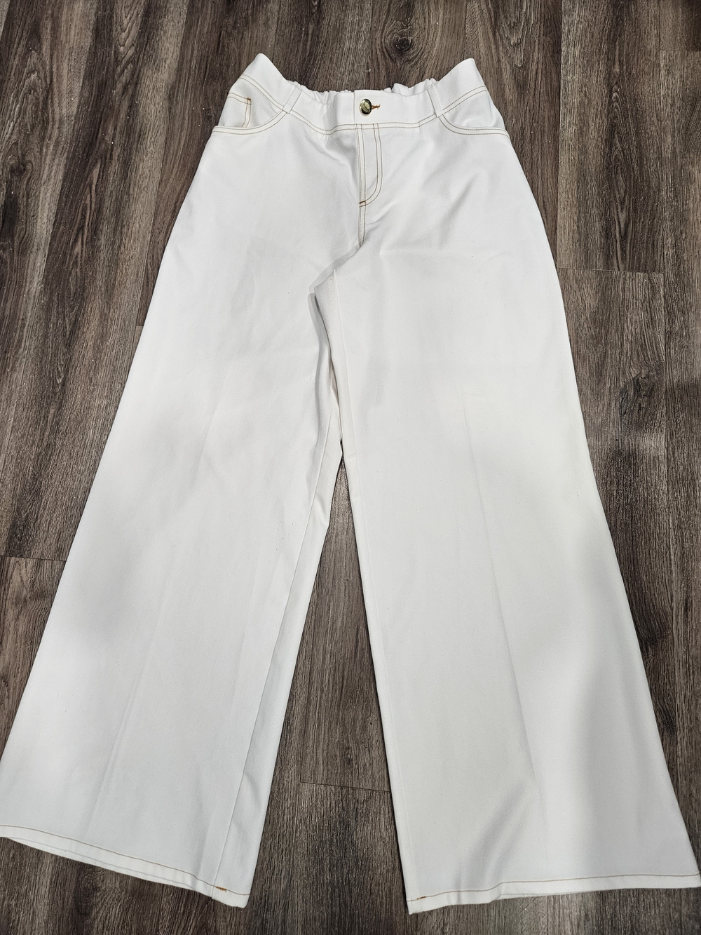 IMAN White Pants with Gold Logo Plate and Tan Stitching